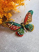 Broche CHARLYN grand papillon strass rouge vert et orangé