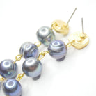 E75511 Boucles d'oreilles pendantes linéaires perles Paon - Karine Sultan