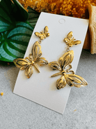 Boucles d’oreilles BLANCHE papillons dorés